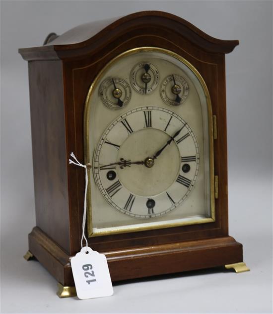A chiming mahogany mantel clock